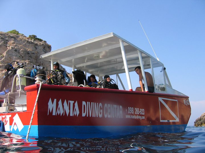 Divers and training gear on the Manta boat near Vis